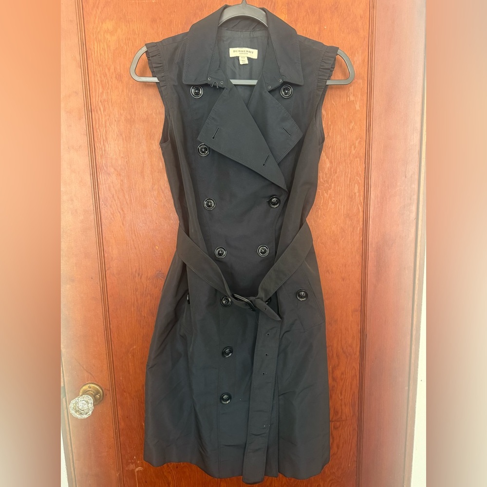 Navy Burberry London Trench with a slight sheen & a subtle ruffle sleeve.